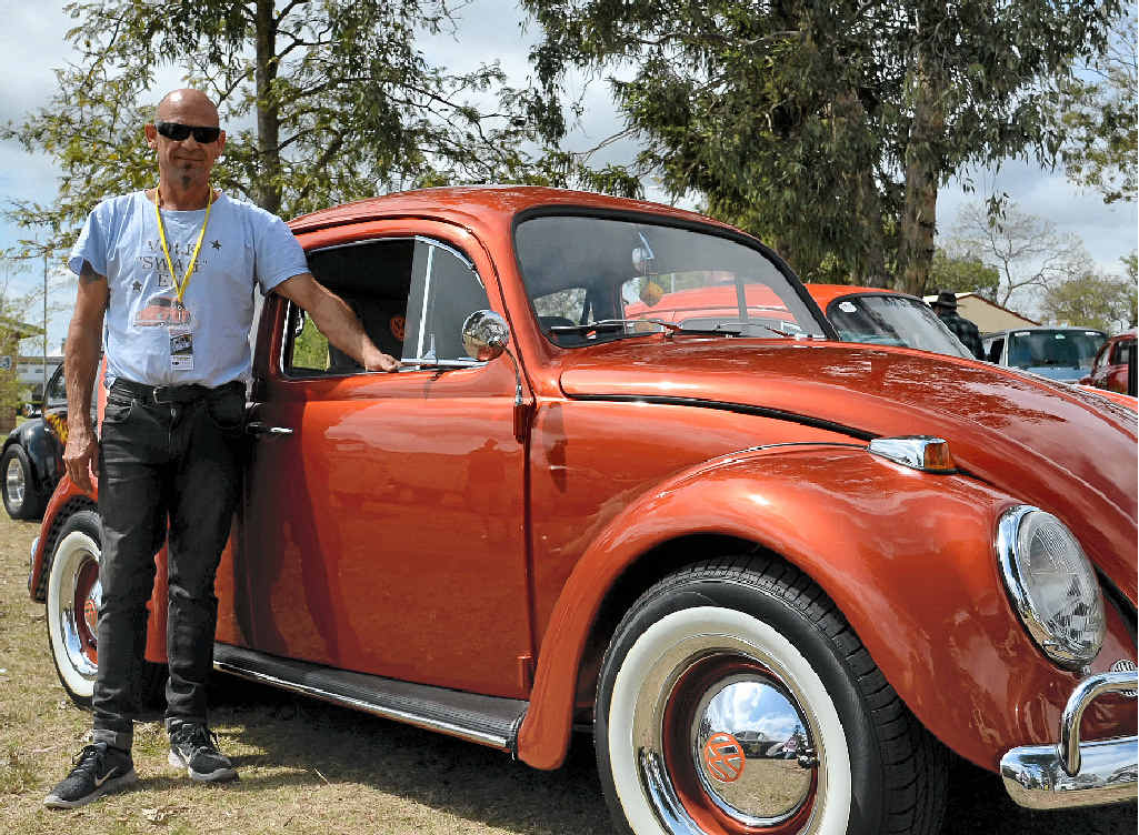 Ray Johnston from the Gold Coast with his 1966 VW Beetle Tangerine Dream, named after the Beatle’s song, at the display in Leslie Park on Saturday.